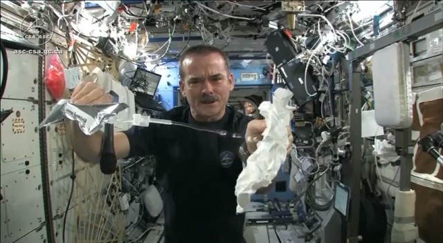 wringing a towel in space